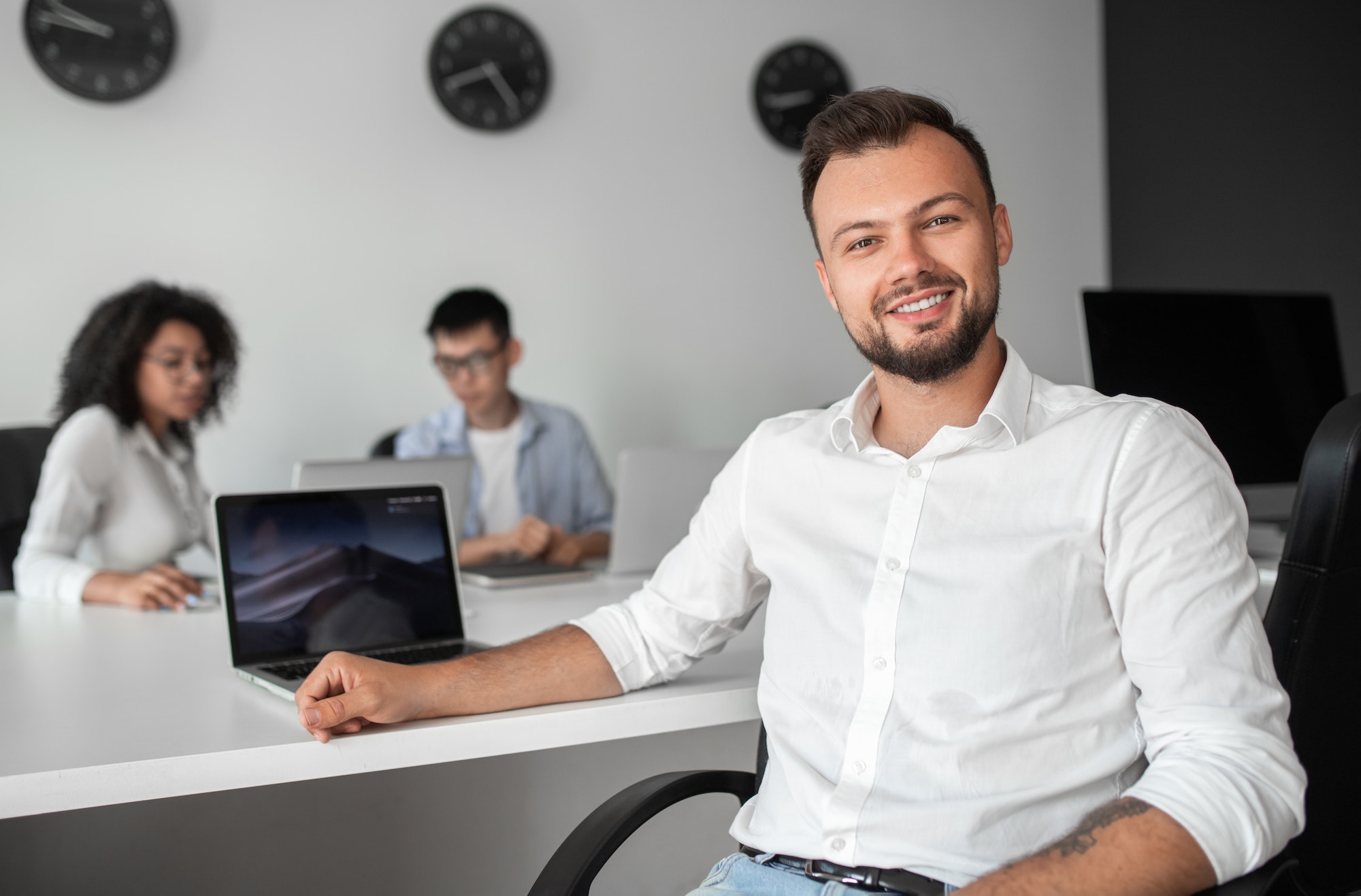 bearded-manager-with-laptop-in-office.jpg